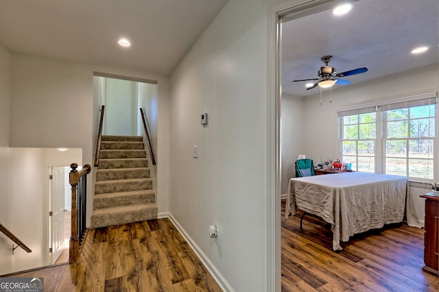 interior space with hardwood / wood-style flooring and ceiling fan