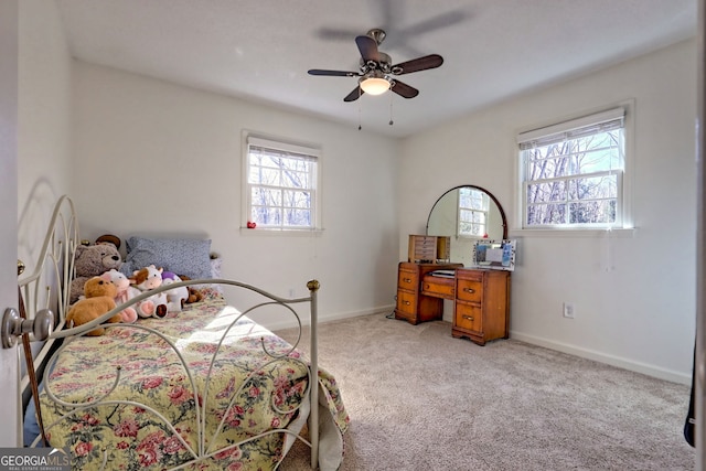 bedroom featuring ceiling fan and light colored carpet