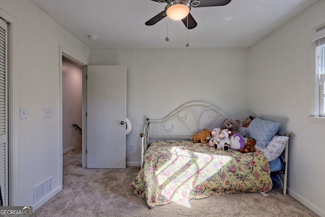 bedroom featuring ceiling fan and light colored carpet