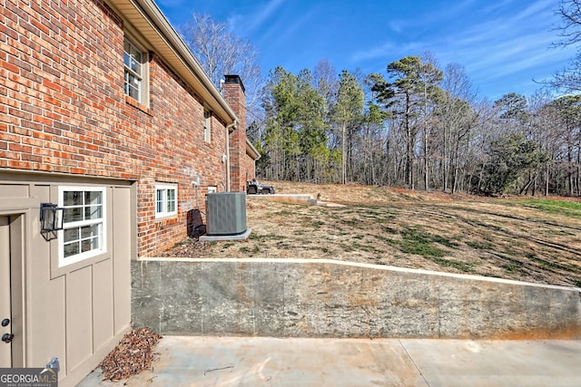 view of yard featuring central air condition unit