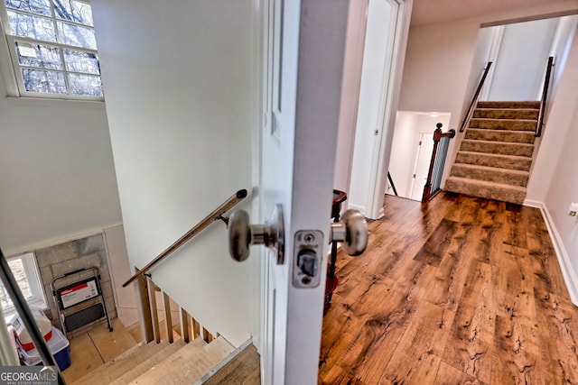 stairway featuring hardwood / wood-style flooring