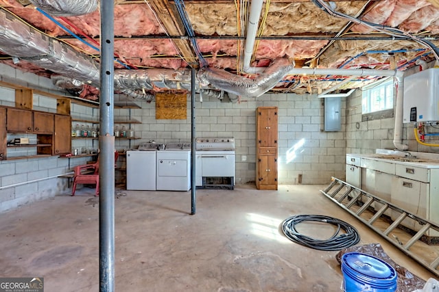 basement with tankless water heater, washing machine and dryer, sink, and electric panel