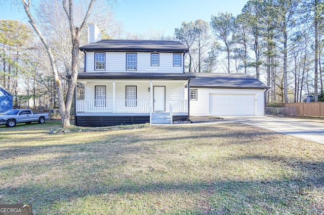 front facade featuring a porch, a front lawn, and a garage