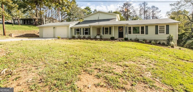 view of front of house featuring a garage and a front yard