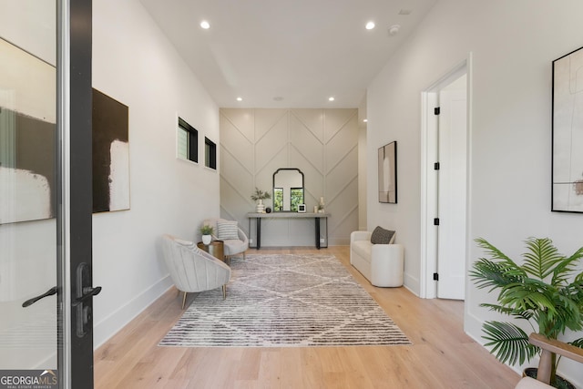 corridor with light hardwood / wood-style flooring