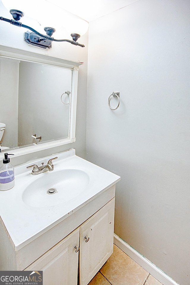 bathroom with tile patterned flooring and vanity