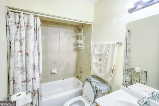 bathroom featuring shower / tub combo with curtain and toilet