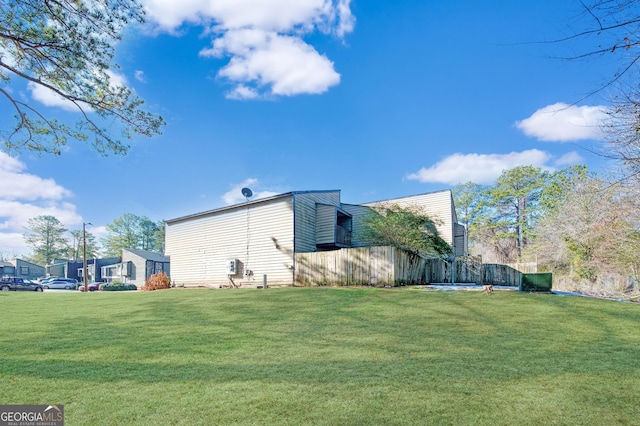 view of side of property with a yard