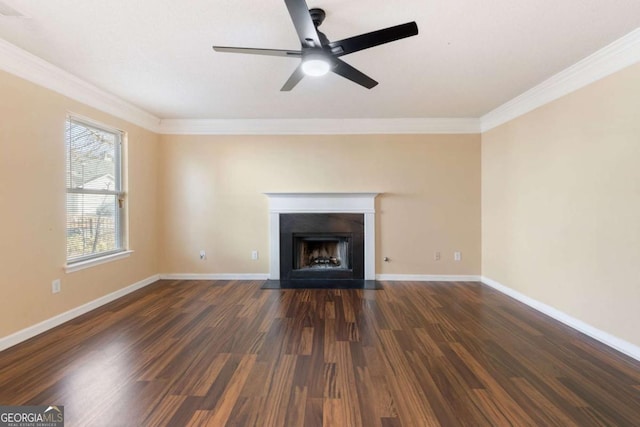 unfurnished living room featuring ceiling fan, dark hardwood / wood-style flooring, and crown molding