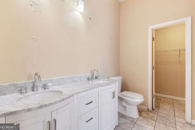 bathroom with toilet and vanity