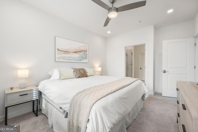 bedroom with ceiling fan and light carpet