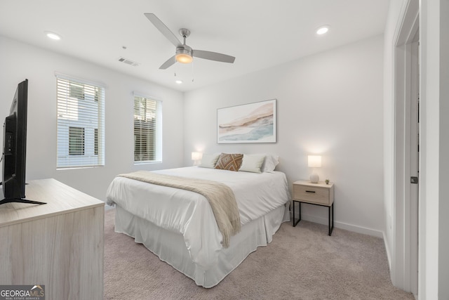 bedroom featuring ceiling fan and light colored carpet