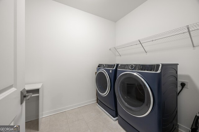 washroom featuring washing machine and dryer