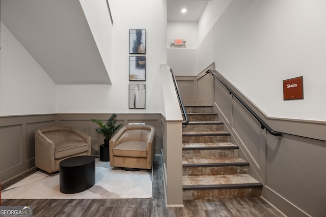 staircase with wood-type flooring