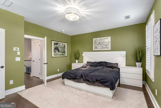 bedroom with wood-type flooring