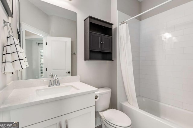 full bathroom with shower / tub combo with curtain, vanity, and toilet