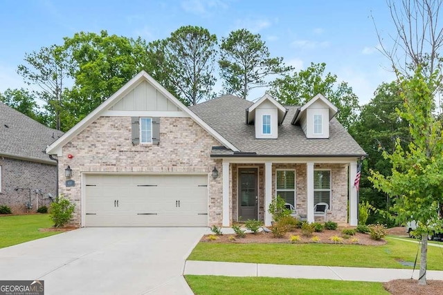 view of front of house featuring a front yard and a garage