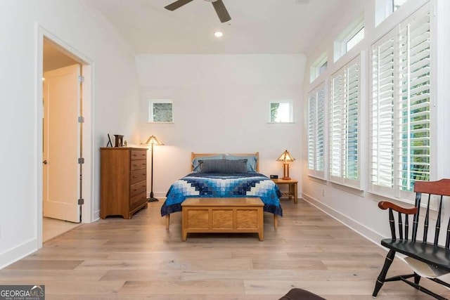 bedroom with ceiling fan and light hardwood / wood-style flooring