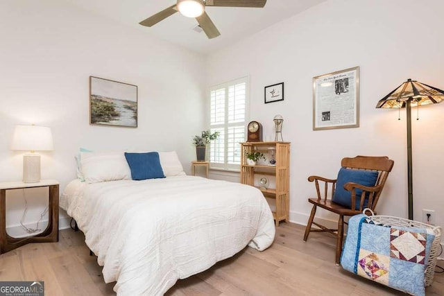 bedroom featuring ceiling fan and light hardwood / wood-style flooring