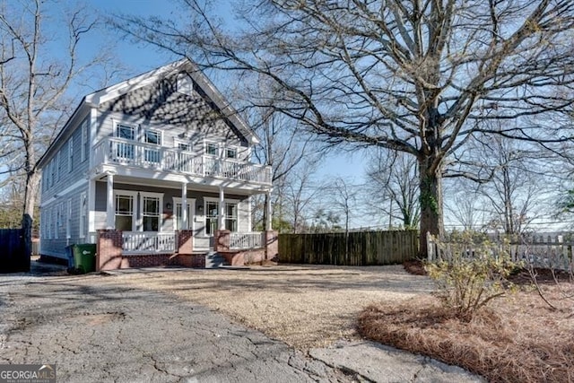 view of front of home with a balcony and a porch