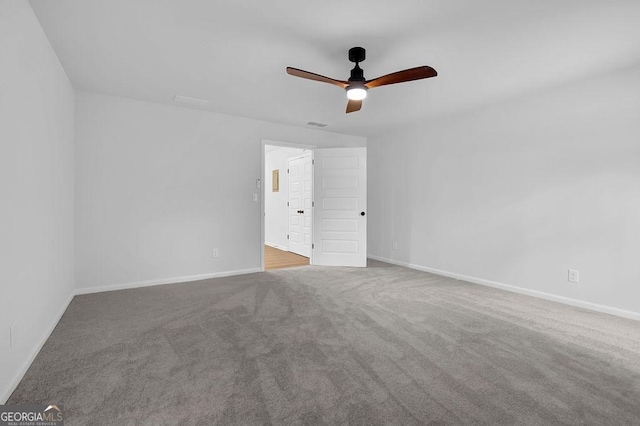 unfurnished bedroom featuring carpet floors, visible vents, baseboards, and a ceiling fan