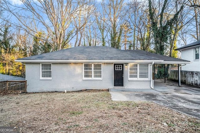 single story home featuring a carport