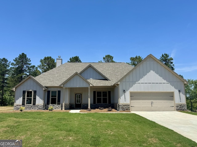 view of front facade with a front yard and a garage