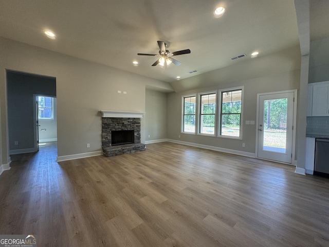 unfurnished living room featuring a fireplace, ceiling fan, and hardwood / wood-style floors