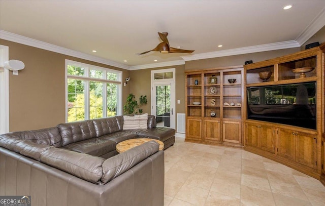 living room with ceiling fan and ornamental molding