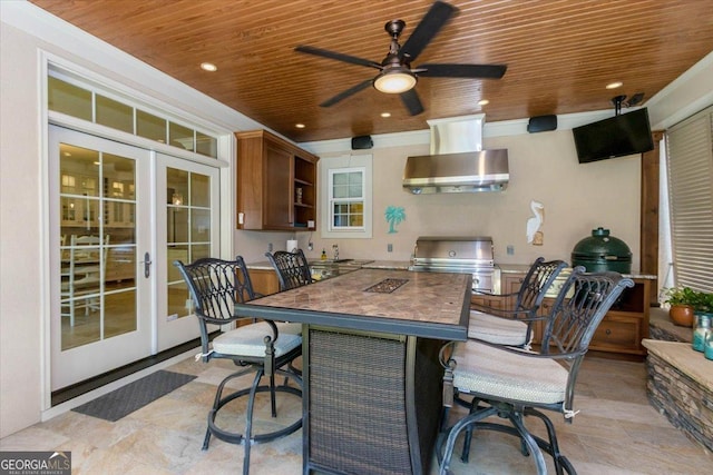 view of patio featuring an outdoor kitchen, french doors, grilling area, and ceiling fan