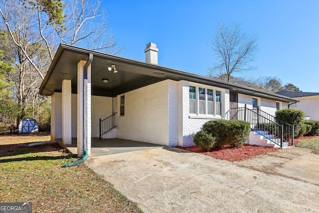 exterior space featuring a carport