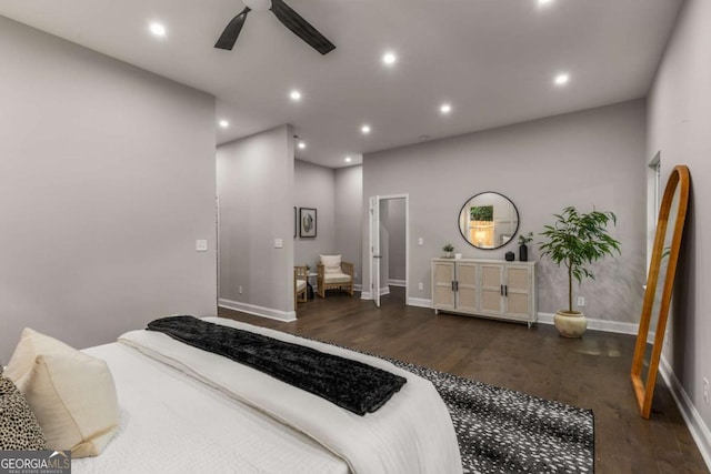 bedroom with dark hardwood / wood-style flooring and ceiling fan