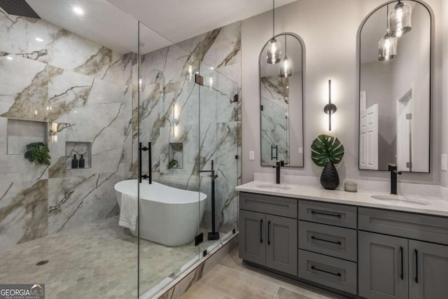 bathroom featuring vanity and shower with separate bathtub