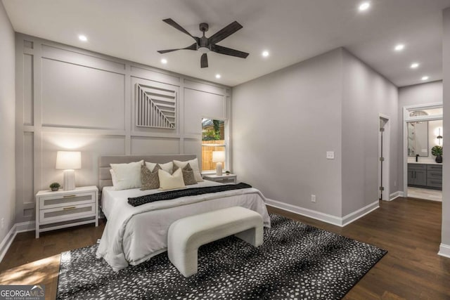 bedroom with ensuite bathroom, ceiling fan, and dark hardwood / wood-style floors