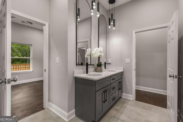 bathroom featuring tile patterned flooring and vanity