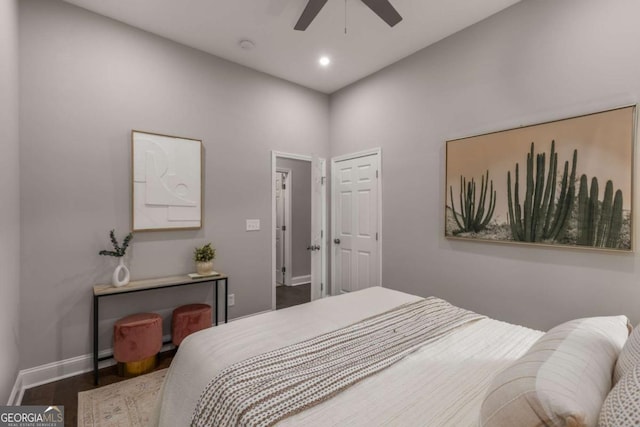 bedroom with ceiling fan and dark hardwood / wood-style floors