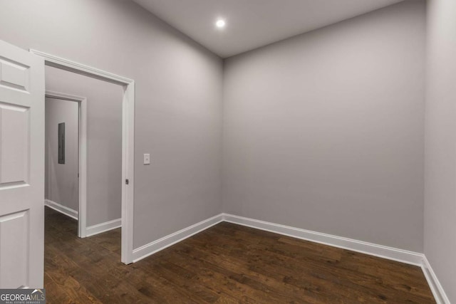 spare room with dark hardwood / wood-style flooring