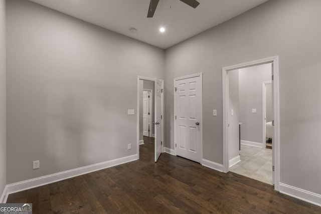 interior space with ceiling fan and dark hardwood / wood-style floors