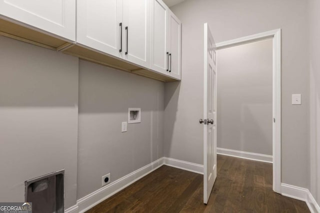 washroom featuring washer hookup, cabinets, dark hardwood / wood-style floors, and hookup for an electric dryer