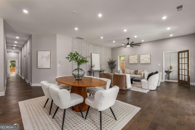 dining area featuring dark hardwood / wood-style flooring and ceiling fan