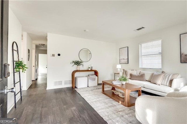 living room featuring dark hardwood / wood-style flooring