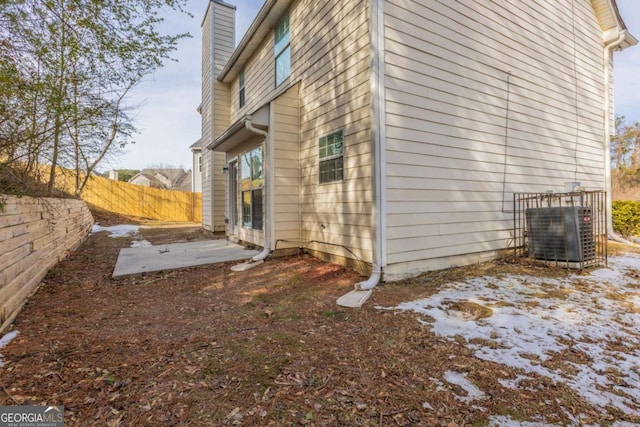 view of side of property featuring central air condition unit