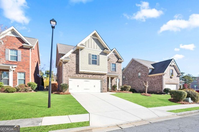 view of front of property with a front yard and a garage