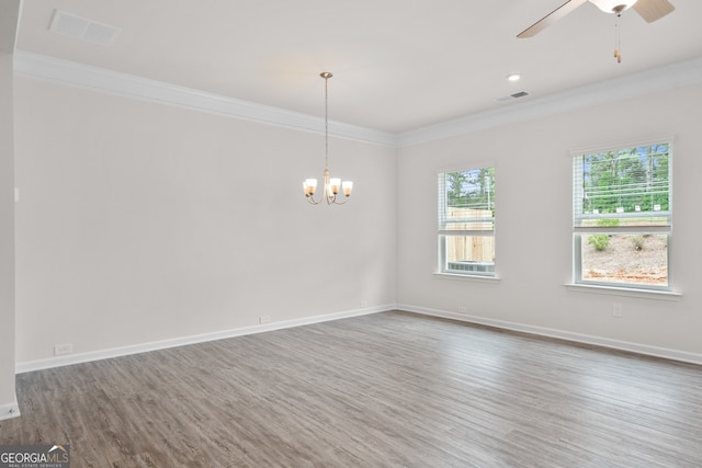 unfurnished room with hardwood / wood-style floors, crown molding, and ceiling fan with notable chandelier