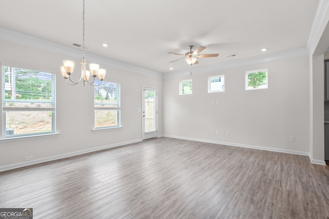 spare room featuring ceiling fan with notable chandelier, hardwood / wood-style flooring, and ornamental molding