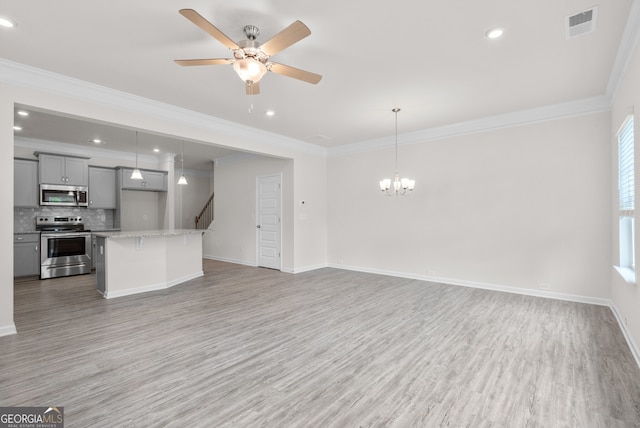 unfurnished living room with light wood-type flooring, crown molding, and ceiling fan with notable chandelier