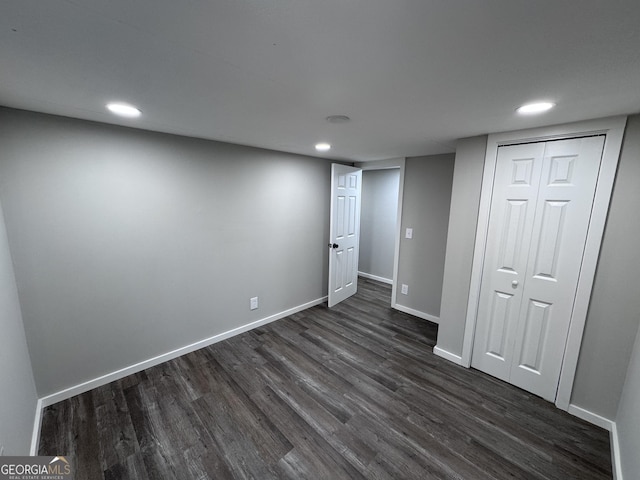 interior space with a closet and dark wood-type flooring