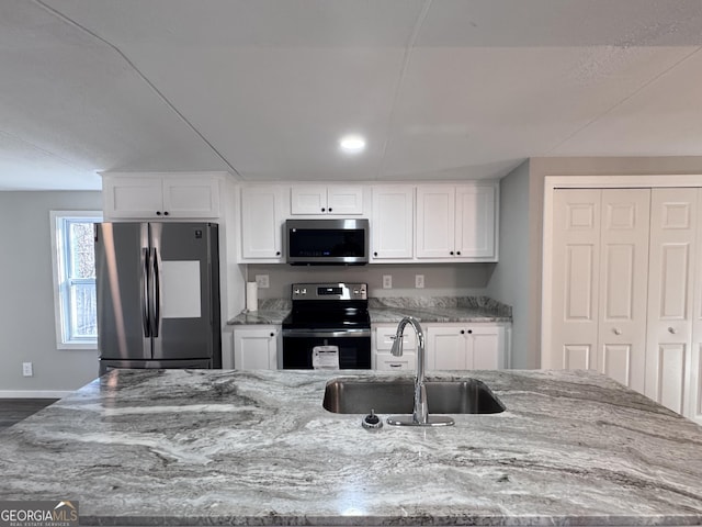 kitchen featuring sink, white cabinetry, and appliances with stainless steel finishes