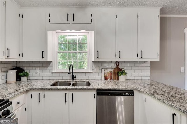 kitchen with sink, white cabinets, light stone counters, and appliances with stainless steel finishes