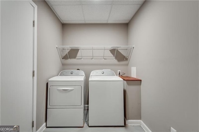 clothes washing area with separate washer and dryer